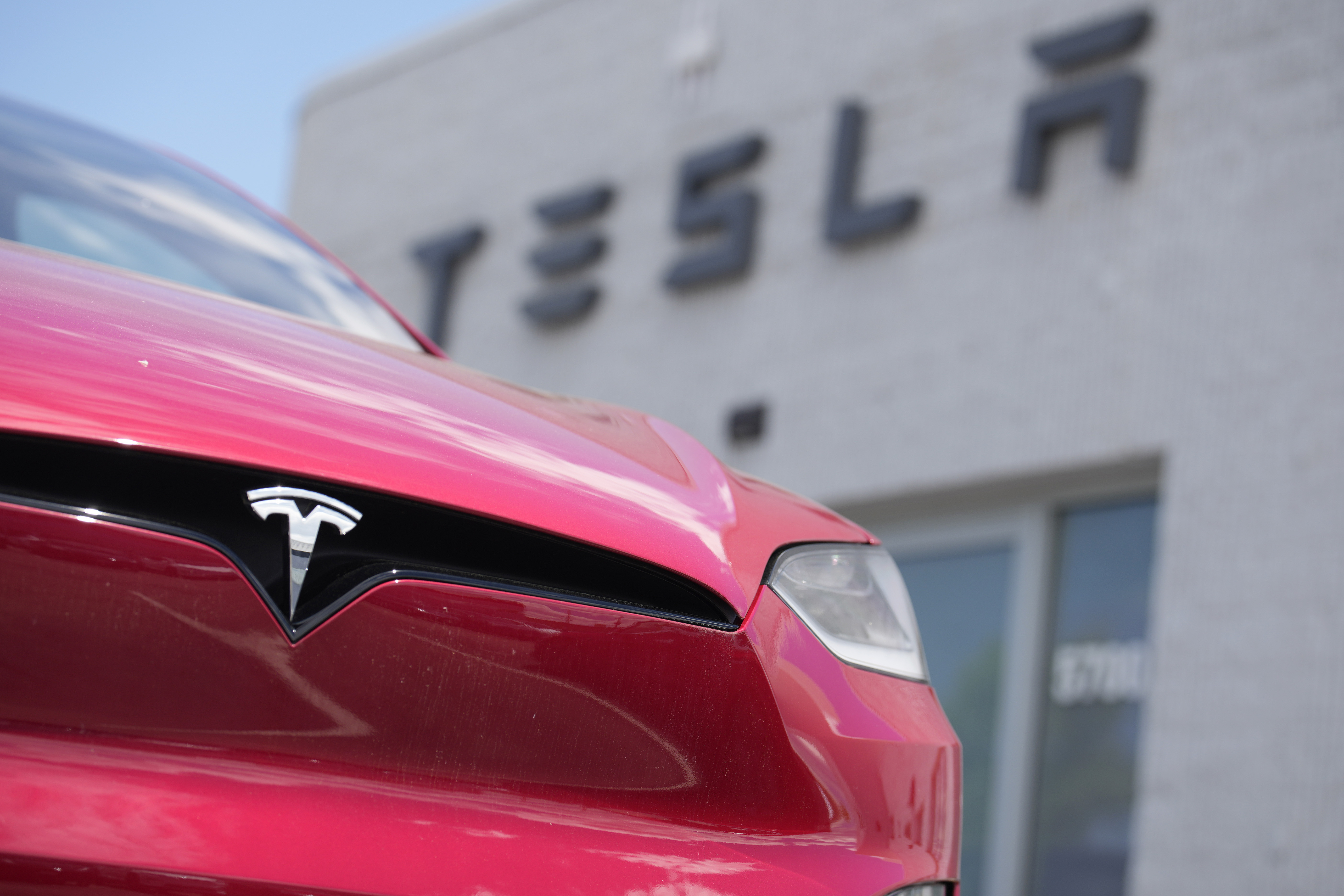Tesla profits slumped 46 % last year , as it lost its crown as the top EV seller