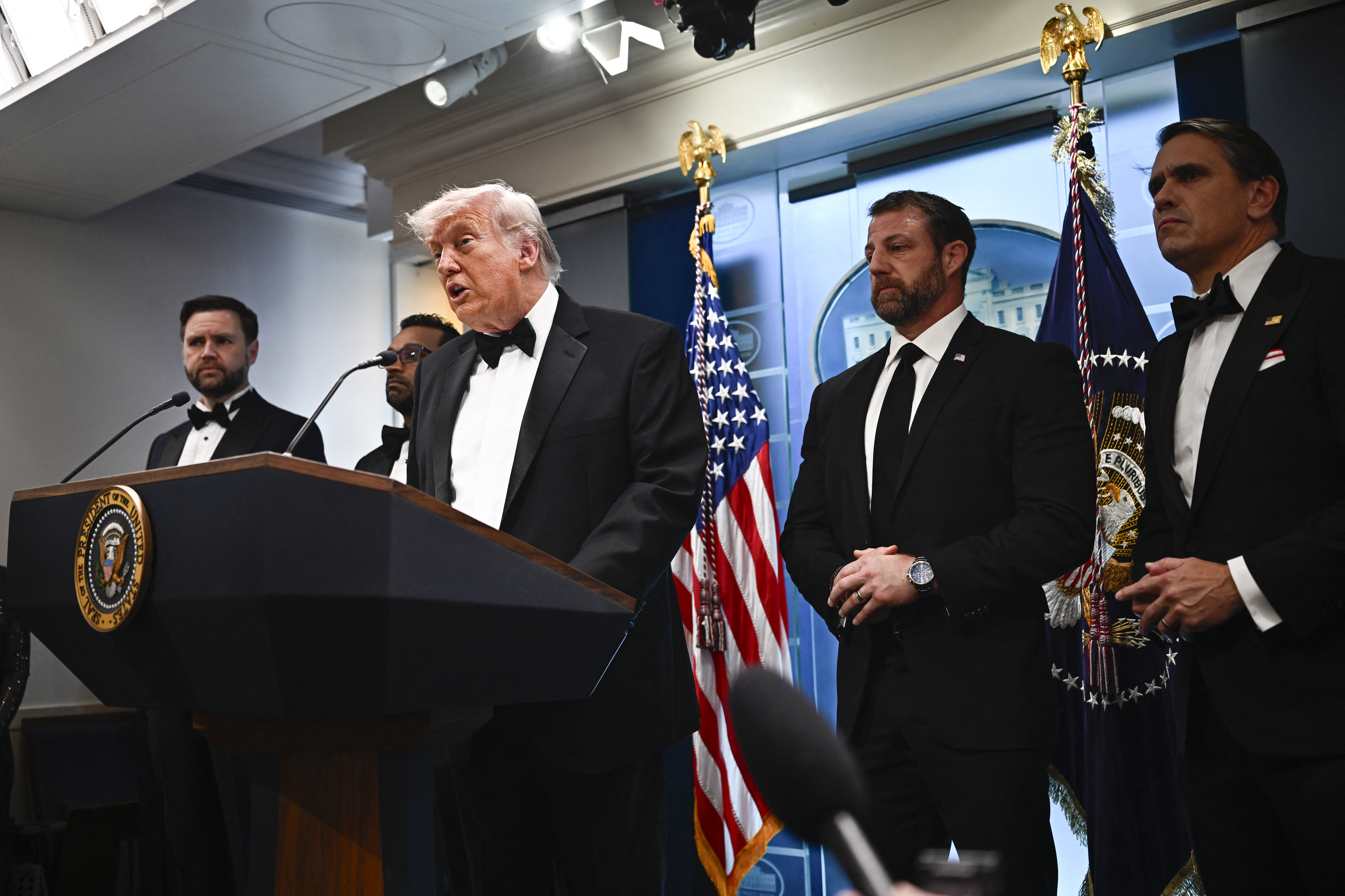 A suspect is in custody after Trump is rushed from correspondents' dinner