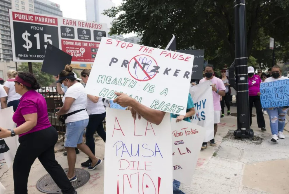 Immigrant advocates slam Pritzker for cutting health care program for noncitizens - Vimarsana News